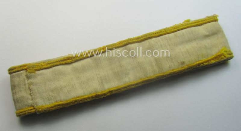 Truly worn WH cuff-title (ie. 'Ärmelstreifen') entitled: 'Kreta' (being an example that bears a printed 'RbN.'-numeral and that comes in an issued-, clearly worn- and/or most certainly once tunic-attached, condition)