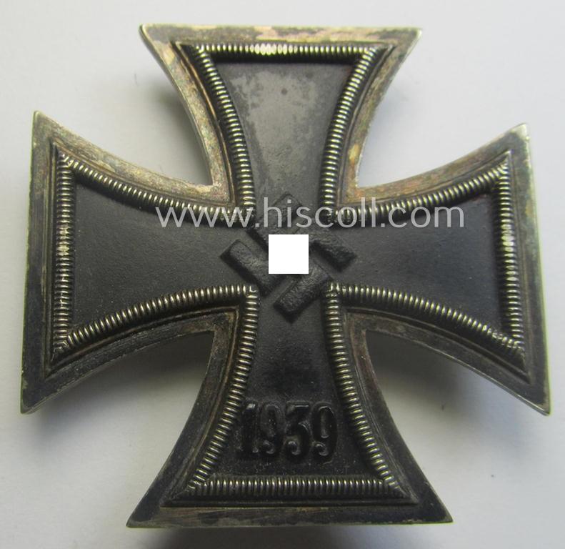 Moderately used, Iron Cross 1st class (or: 'Eisernes Kreuz 1. Klasse') as executed in the scarcely seen so-called: 'screw-back'- (ie. 'An der Schraube'-) pattern being a non-maker-marked example