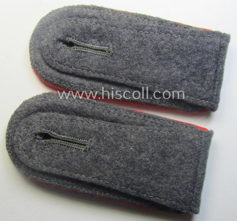 Pair of WH (Luftwaffe) NCO-type shoulderstraps as piped in the bright-red branchcolour as was intended for a: 'Feldwebel o. Wachtmeister der Flak-Artillerie-Trpn.'