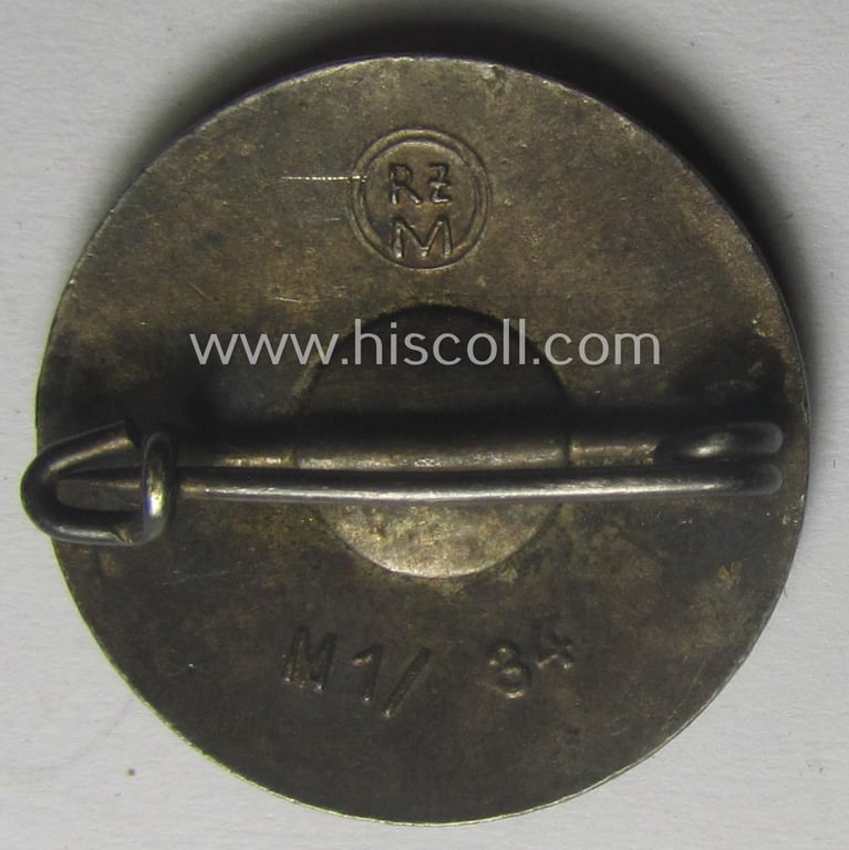 'N.S.D.A.P.'-membership-pin- ie. party-badge (or: 'Parteiabzeichen') showing the makers'-designation: 'RzM' and/or: 'M1/34' (= 'K. Wurster - Markneukirchen')