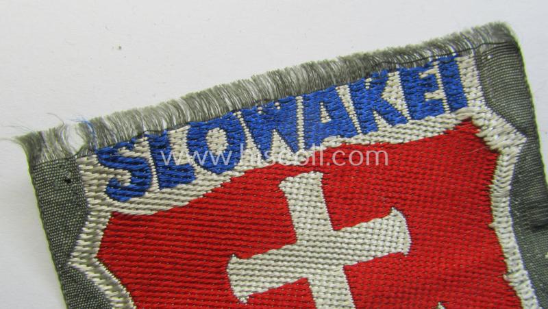 Attractive - albeit minimally damaged! - 'BeVo'-type armshield entitled: 'Slowakei' (being a piece that was intended for a volunteer who served within the: 'Deutsche Wehrmacht' ie. within the: 'Slowakisches Legion')