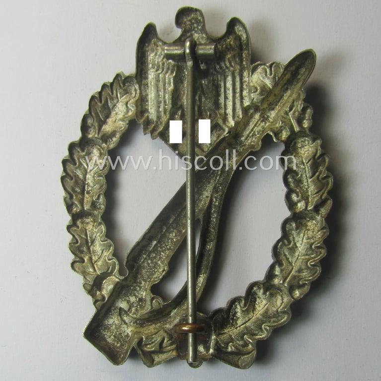 'Infanterie Sturmabzeichen in Silber' being an unmarked, 'variant'-pattern-example as executed in 'hollow-styled', silverish-toned metal (ie. 'nickle') as was produced by the: 'C.E. Juncker'-company