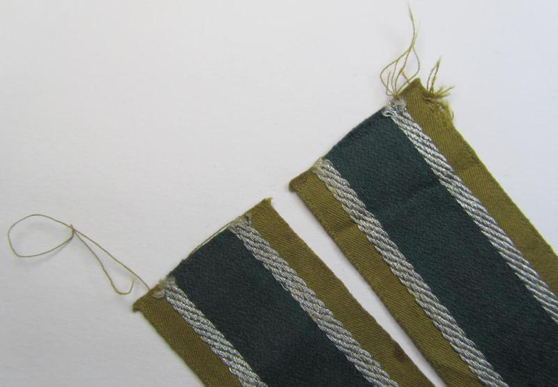 Superb, 'BeVo'-like cuff-title (ie. 'Ärmelstreifen') entitled: 'Afrikakorps' being a with certainty issued and truly worn example that comes in an overall nice- (ie. non-shortened- and most certainly once tunic-attached-), condition