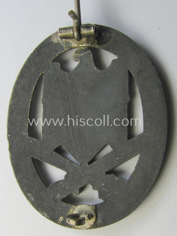 'Allgemeines Sturmabzeichen' being a non-maker-marked, zinc- (ie. 'Feinzink'-) based example by: 'C.E. Juncker'