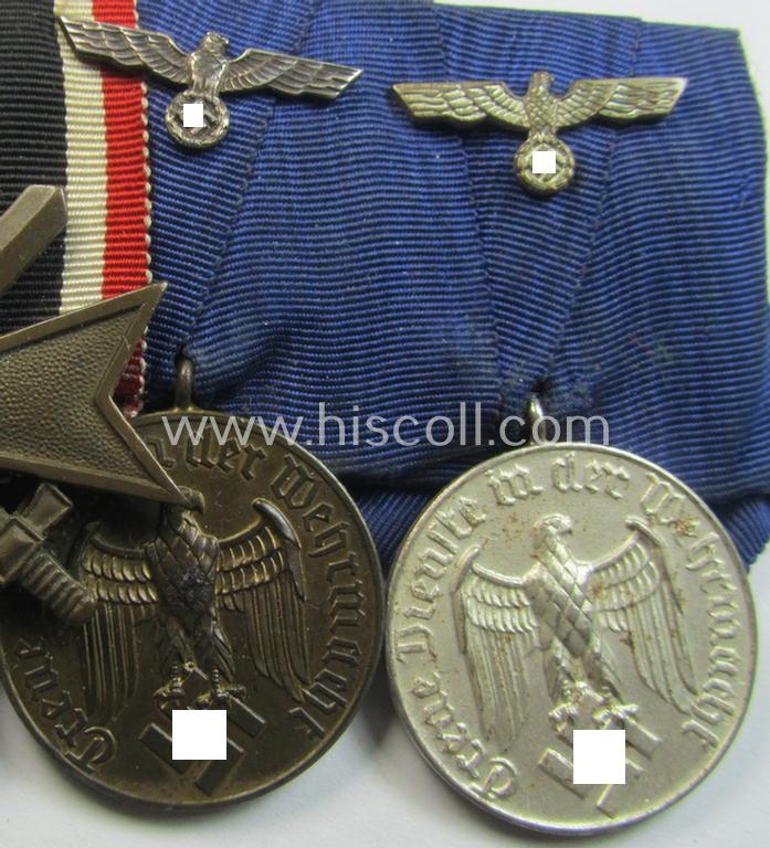 Three-pieced medal-bar (ie. 'Ordenspange') respectively depicting a: 'KvK II. Klasse m. Schwertern' and two: WH (Heeres or KM) so-called: 'Dienstauszeichnungen für 4 u. 12 Jahre Treue Dienste'