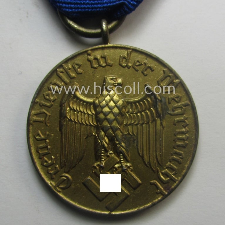 WH (Heeres o. KM) bright golden-toned 'WH-DA der 3. Klasse für 12 Jahre Dienstzeit' that comes mounted onto its accompanying ribbon (ie. 'Bandabschnitt') having a golden-toned eagle-device attached