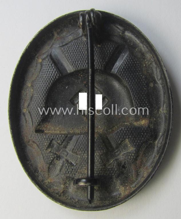 Black-class wound-badge (or: 'Verwundeten-Abzeichen in Schwarz') being a maker- (ie. '4'-) marked specimen as was produced by the maker (ie. 'Hersteller') named: 'Steinhauer & Lück'