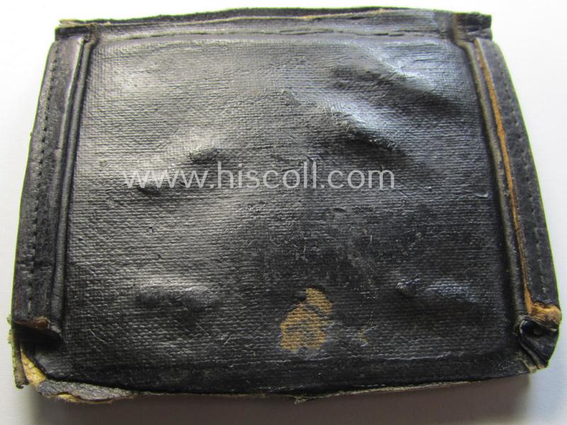Unusual, WH (Luftwaffe) item that comes as a 'period-souvenir': a part of a leather-based 'wallet' that holds various LW-insignia (such as a visor-cap-eagle, single pip, 'Schwinge' and a: - presumed - LW-'Traditions-Abz.')
