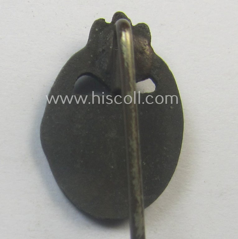 Neat - and 17 mm. sized! - miniature-lapel-pin depicting a: 'Panzerkampfabzeichen in Bronze' (or: bronze-class panzer-assault-badge ie. PAB) being a non-maker-marked example as executed in darkened, bronze-coloured metal