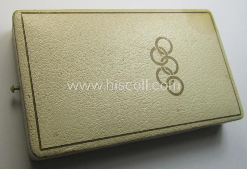 Superb, 'Deutsche Olympia-Erinnerungsmedaille 1936' being a non-maker-marked example that comes mounted onto its original ribbon (ie. 'Bandabschnitt') and that comes stored in its typical, beige-white-coloured etui as issued and stored for decade...