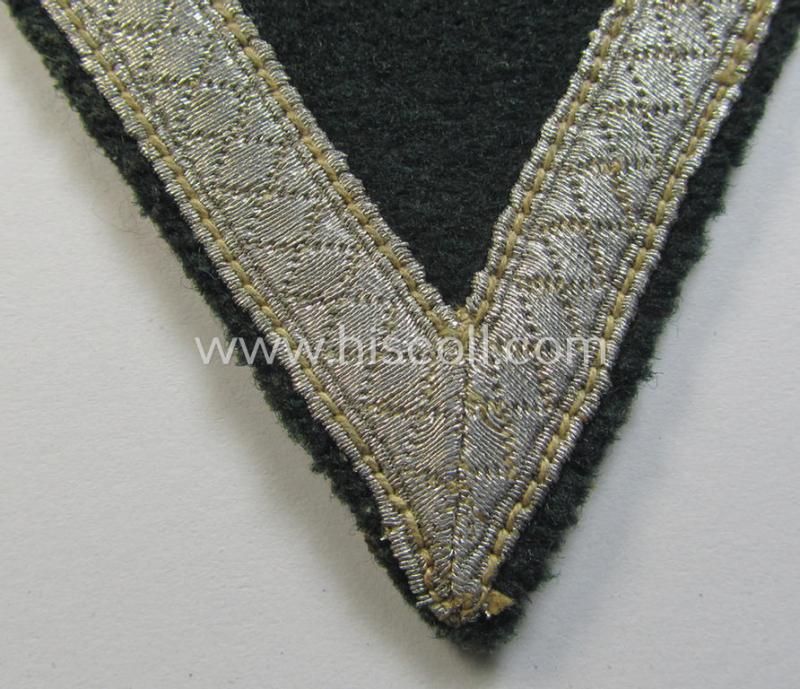 Neat - and just moderatelly used! - WH (Heeres) 'Armwinkel' (or: arm-chevron) as executed on typical darker-green-coloured wool as was specifically intended for usage by a soldier with the rank of: 'Gefreiter'