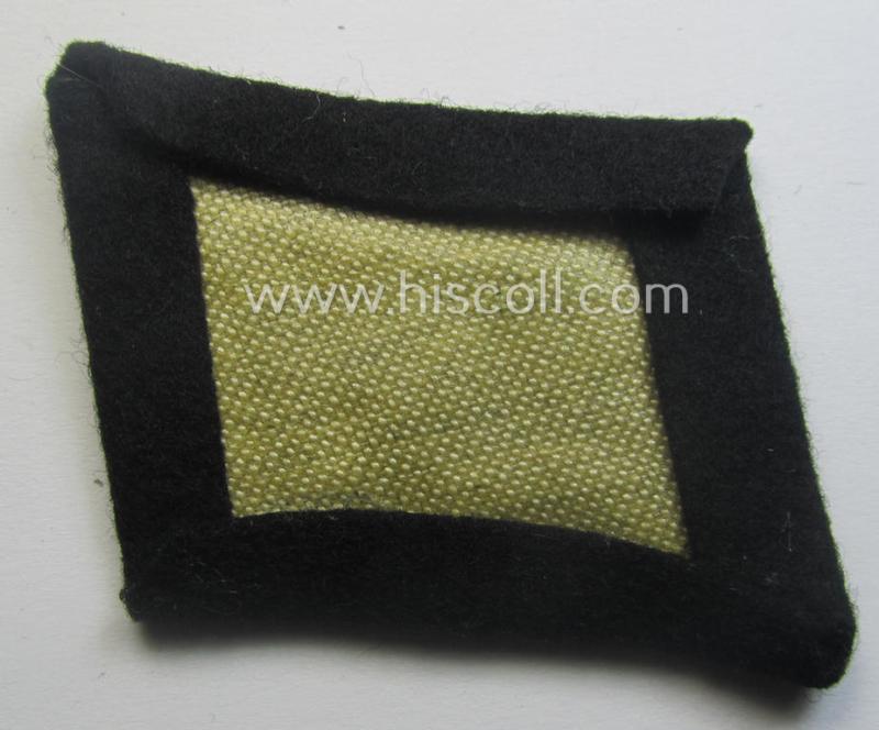 Waffen-SS EM-pattern rank-collar-rank-tab ('Kragenspiegel') being a 'standard-issue'-pattern example as executed in black-coloured wool as was intended for usage by an: 'SS-Mann'