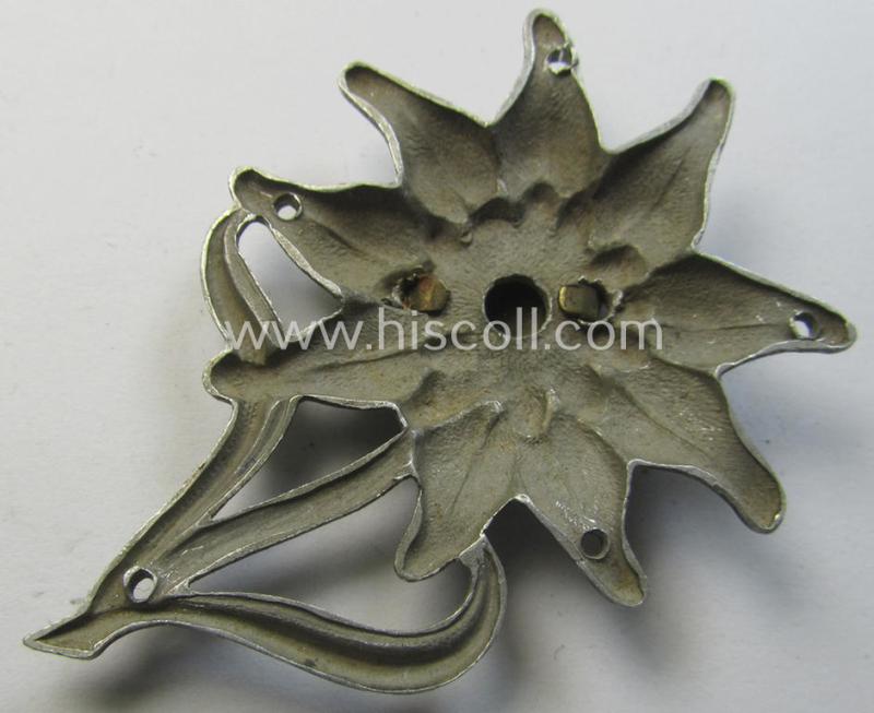WH (Heeres) silverish-coloured and aluminium-based (albeit non-maker-marked) so-called: M43-cap-badge (ie. 'Mützenabzeichen') depicting an: 'Edelweiss'-flower as was used by the various 'Gebirgsjäger'- (ie. mountain-troops-) related divisional-...