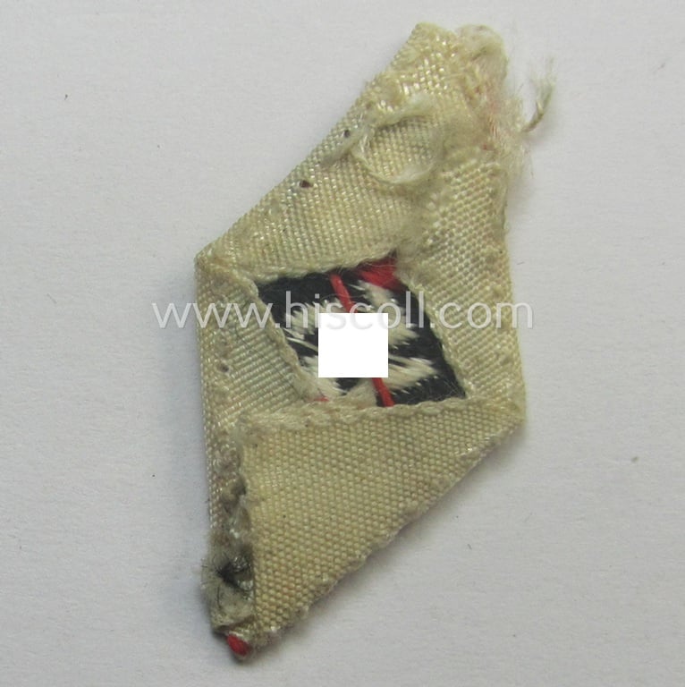 Truly used- and/or cap-removed, HJ (ie. 'Hitlerjugend') cap-badge (ie.: 'Raute') as executed in 'BeVo'-weave-pattern