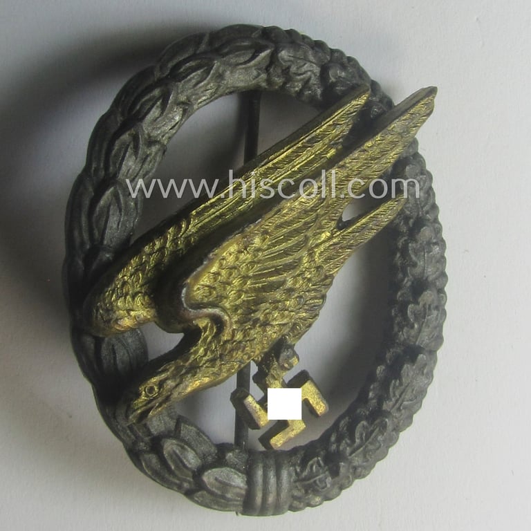 Superb, zinc- (ie. 'Feinzink'-) based version of a WH (Luftwaffe) 'Fallschirmschützen-Abzeichen' (being a non-maker-marked, 'Type G'-pattern example as was produced by the: 'C.E. Juncker'-company)