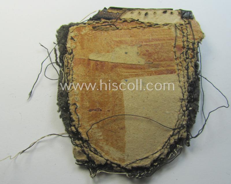 Attractive - truly worn and actually scarcely encountered! - WH (Heeres ie. Waffen-SS) 'Kuban'-campaign-shield that comes mounted onto its original field-grey-coloured- and/or woolen-based 'backing' as issued and/or used