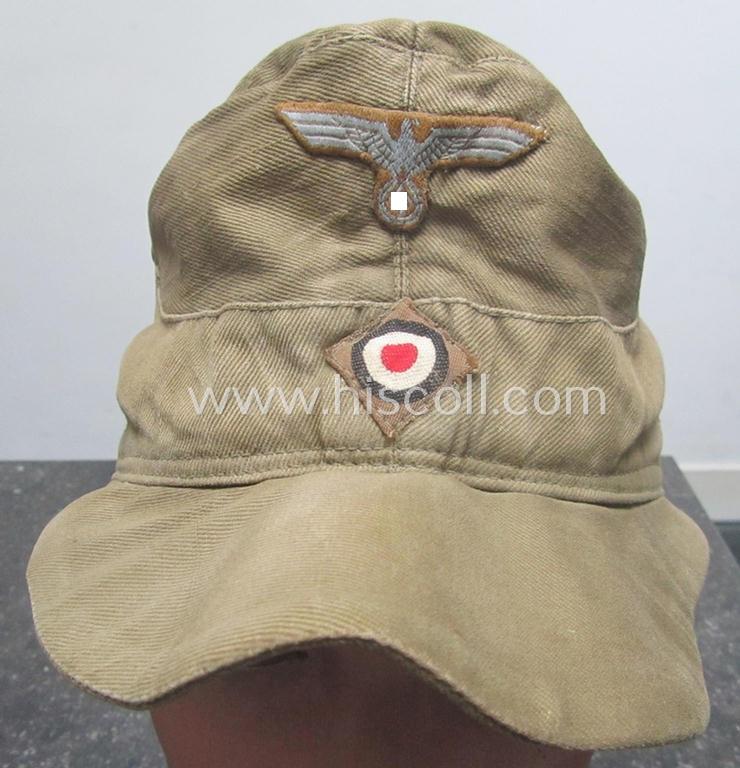 WH (Heeres), 'M41-pattern', tropical-issued field-cap (ie.: 'Tropen-Einheitsfeldmütze') being an (approx.) 57-cms.-sized example that is neatly maker- (ie. 'RbN. nr.'-) marked and that comes in a moderately worn- ie. used, condition