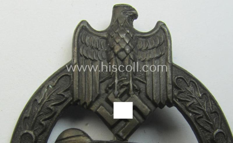 'Panzerkampfabzeichen in Bronze' (or: bronze-class panzer-assault badge or PAB) being a clearly maker- (ie. 'AS' in a triangle-) marked- and/or typical zinc- (ie. 'Feinzink'-) based specimen as was procuced by a to date unknown maker