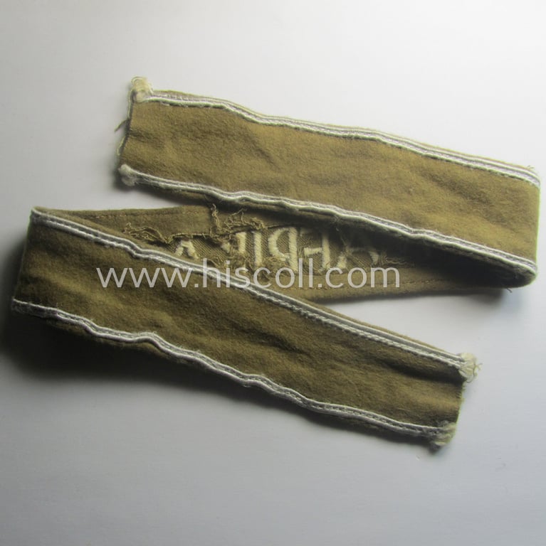 WH (LW o. Heeres) cuff-title (ie. 'Ärmelstreifen') entitled: 'Afrika' (being an example that comes in a presumably issued- albeit simply never used- ie. 'virtually mint' condition)