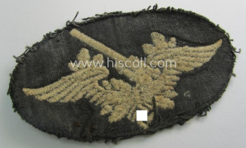 Machine-embroidered WH (Luftwaffe) trade- ie. special-career-patch as was intended for: 'Flak-Artillerie'-staffmembers and that comes in a clearly used- and/or carefully tunic-removed condition