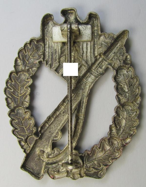 Attractive, 'hollow-back'-pattern 'Infanterie Sturmabzeichen in Silber' (or: silver infantry-assault badge ie. IAB) being a non-maker-marked example as executed in zinc-based metal (ie. 'Feinzink') as was produced by the: 'Wilh. Deumer'-compa...