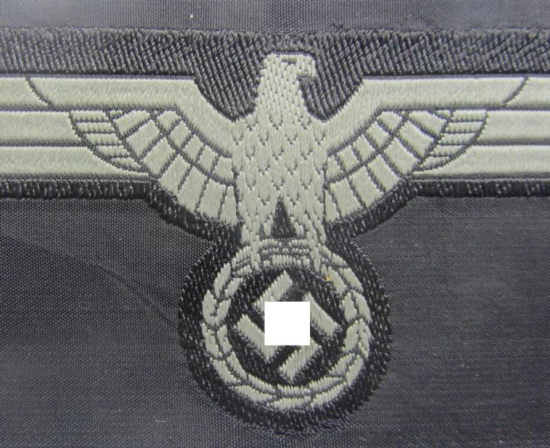 Later- (ie. mid-war-) period, WH (Heeres) 'Panzer'-type breast-eagle (ie. 'Brustadler für Panzertruppen') being a 'virtually mint- ie. unissued' example as executed in bluish-grey-coloured linnen on a black-coloured background