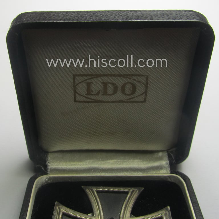 Stunning, 'EK 1. Klasse' (or: Iron Cross 1st class) as executed in the scarcely seen so-called: 'screw-back'-pattern being a maker- (ie. 'L/11'-) marked example that comes stored in its accompanying (and equally marked!) etui as issued