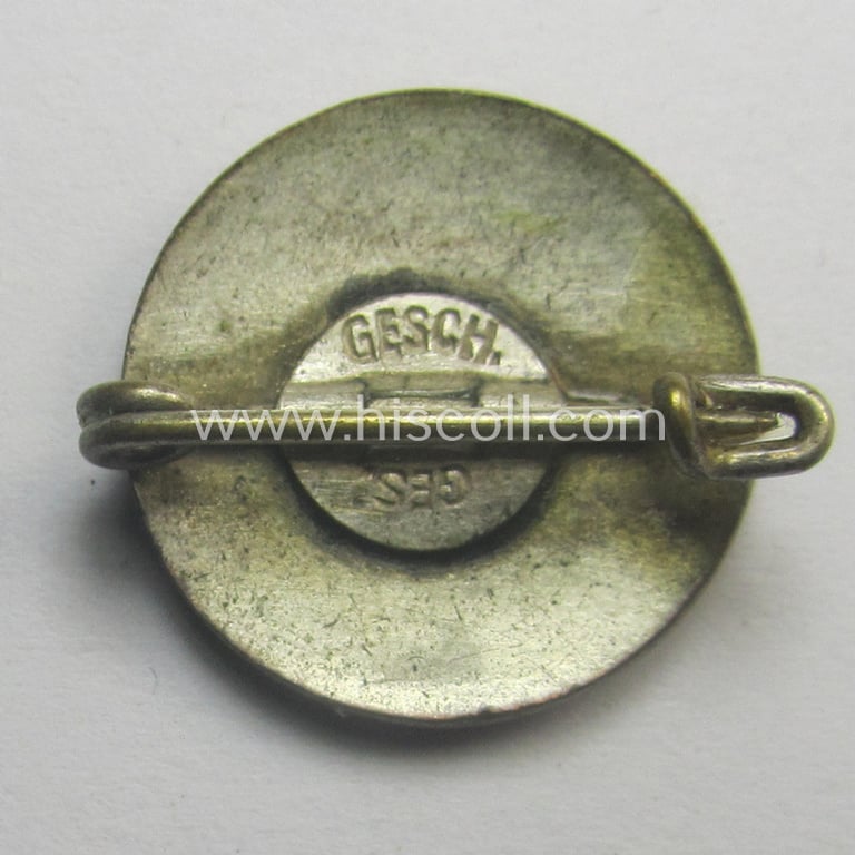Unusually seen - smaller-sized- and darker-red-coloured! - 'N.S.D.A.P.'-membership-pin- ie. party-badge (or: 'Parteiabzeichen') being a non-maker-marked example that shows a: 'Ges.Gesch.'-patent-pending-designation