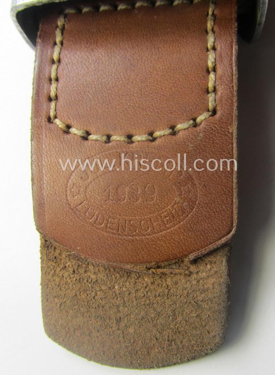 WH (Heeres) 'standard-pattern', field-grey-toned- and aluminium-based belt-buckle being a maker- (ie. 'Jul. Kremp'-) marked- and/or: '1939'-dated example that comes mounted onto its leather-based tab