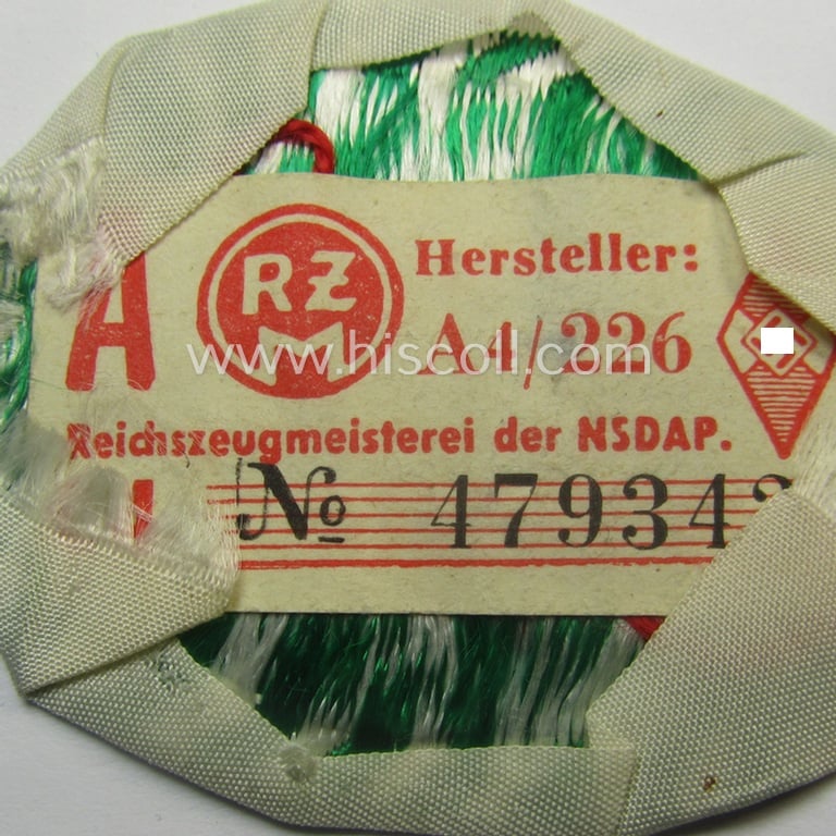 HJ/BDM (ie. 'Hitlerjugend'/'Bund Deutscher Mädel') trade- ie. specialist-armbadge as executed in neat 'BeVo'-weave pattern as was specifically intended for a: 'Gefolgschaftsfeldscher' that still retains its 'RzM'-etiket