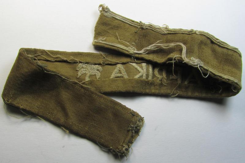 Attractive - and clearly worn! - WH cuff-title (ie. 'Ärmelstreifen') entitled: 'Afrika' (being a period-shortened example that comes in an overall nice- ie. issued and clearly worn ie. once tunic-attached, condition)