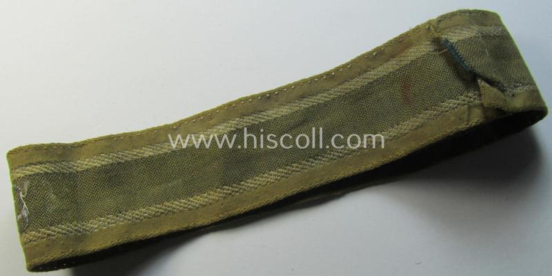 Superb, 'BeVo'-like cuff-title (ie. 'Ärmelstreifen') entitled: 'Afrikakorps' being a with certainty issued and truly worn example that comes in an overall nice- (ie. minimally shortened-, still sewn-together- and/or once tunic-attached-), condi...