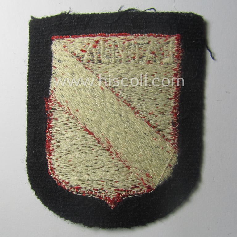 Waffen-SS 'volunteer'-arm-shield as was intended for usage by soldiers of the: '15. o. 19. Waffen-Grenadier-Division der SS' (ie. 'lettische nr. 1 o. 2') and that comes in a 'virtually mint- ie. unissued', condition