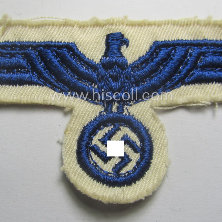 Minimally used- and/or tunic-removed, WH (KM) related breast-eagle (ie. 'Brustadler für Mannschaften u. Uffz. der Kriegsmarine') being a 'standard-issue'-pattern-example as executed in the machine-embroidered-pattern onto a white-coloured background