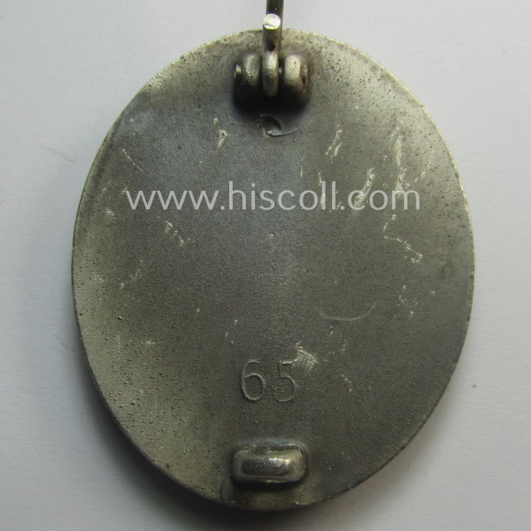 Complete, silver-class wound-badge- (or: 'Verwundeten-Abzeichen in Silber'-) set comprising of a maker- (ie. '65'-) marked example (and miniature!) as produced by the 'Hersteller' ie. maker: 'Klein u. Quenzer'