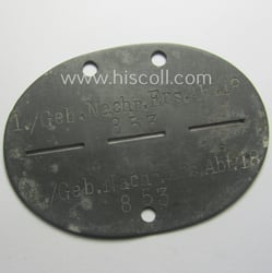 Zinc-based, WH (Heeres) 'Gebirgsjäger-Nachrichten'-related ID-disc bearing the clearly...