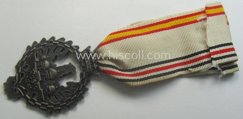 Attractive example of a Spanish-issued, campaign-medal of the Spanish Blue Division in Russia called: 'Medalla Conmemorativa Division Azul - Medalla de Tropa 1941' that comes mounted on its period ribbon as issued and/or worn