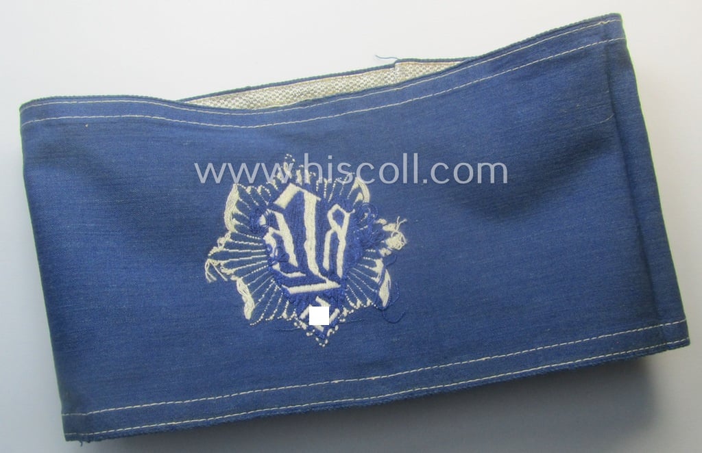 Darker-blue-coloured, RLB (or: 'Reichsluftschutzbund') so-called: 'Amtsträger-Armbinde für Führer' depicting the typical 'RLB'-logo (with lettering) and that comes in a just moderately used- ie. worn, condition