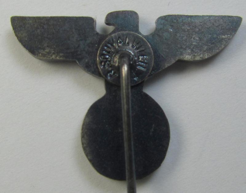 Silverish-coloured - and truly very detailed! - so-called: 'N.S.D.A.P.'-supporter- (ie. membership-) lapel-pin (ie. 'tie'-pin) being a maker- (ie. 'R. Souval'-) marked example showing a pronounced 'Reichsadler'-device