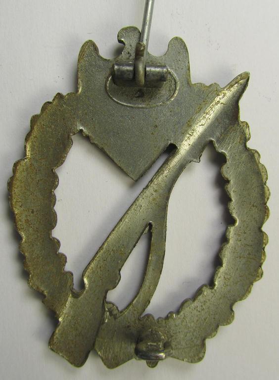 Attractive, 'Infanterie Sturmabzeichen in Silber' being a scarcely seen, non-maker-marked- and/or zinc- (ie. 'Feinzink'-) based specimen as was presumably procuded by the desirable maker (ie. 'Hersteller') named: 'Ernst L. Müller'