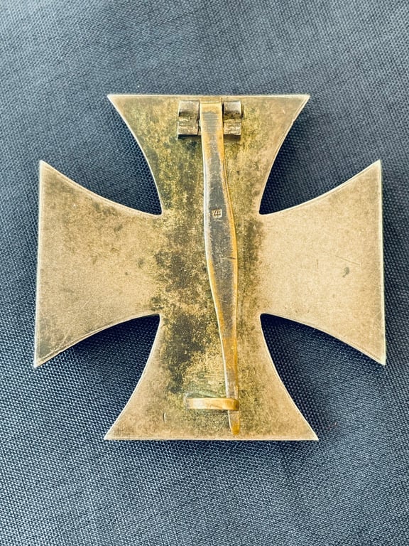 RARE CONCURVED WWII 1ST CLASS IRON CROSS STAMPED NUMBER 4, STEINHAUER & LUCK OF LUDENSCHHELD.