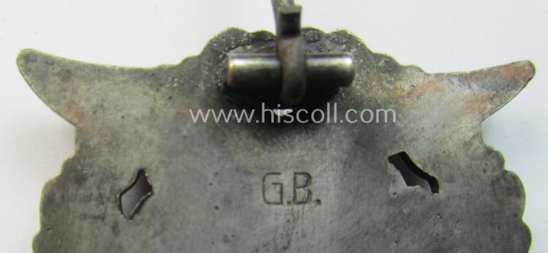Mid- (ie. later-war-) period, zinc- (ie. 'Feinzink'-) based version of a WH (Luftwaffe) 'Erdkampfabzeichen' having a separate eagle-device attached and being a maker- (ie. 'G.B.' or 'Gustav Brehmer'-) marked example