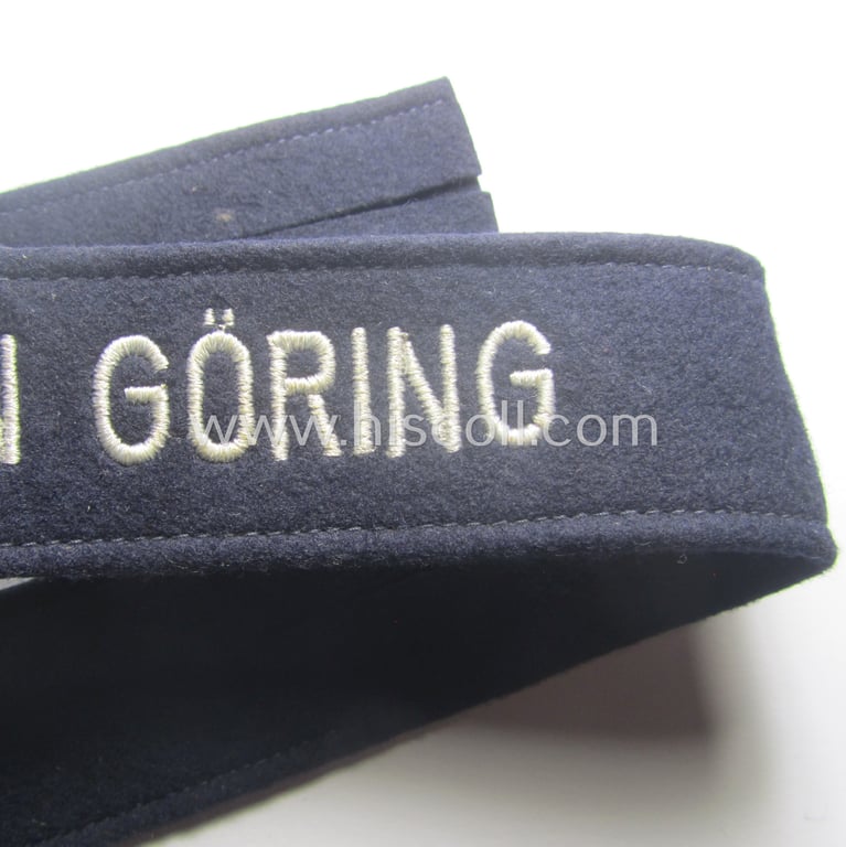 Typical 'smooth-woolen'-based, EM- (ie. NCO-) pattern WH (Luftwaffe) cuff-title (ie. 'Ärmelstreifen') entitled: 'Hermann Göring' that comes in that comes in a presumably issued- albeit (I deem) never worn, condition