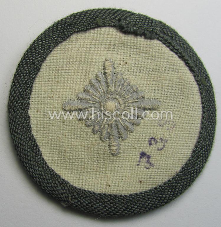 Attractive, WH (Heeres) rank-insignia (ie. arm-roundel) as was specifically intended for usage by an: 'Oberschütze' (being an interesting example as executed in silverish-grey-coloured linnen onto a 'HBT'-type, greenish-coloured background)