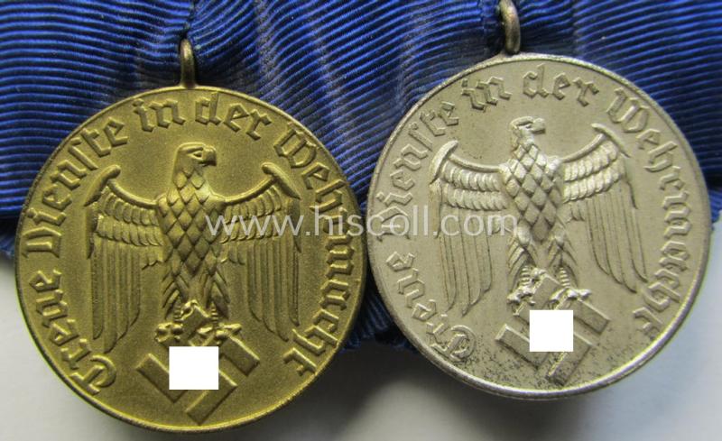 Attractive, two-pieced medal-bar (ie. 'Spange') showing two: WH (Heeres o. Kriegsmarine) so-called: 'Dienstauszeichnungen für 4 u. 12 Jahre Treue Dienste' that both come period-mounted as a so-called: 'Doppelspange'