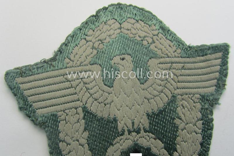 Clearly used- and/or tunic-removed, police- (ie. 'Polizei'-) related armbadge (ie. arm-eagle) being a typical 'BeVo'-woven example