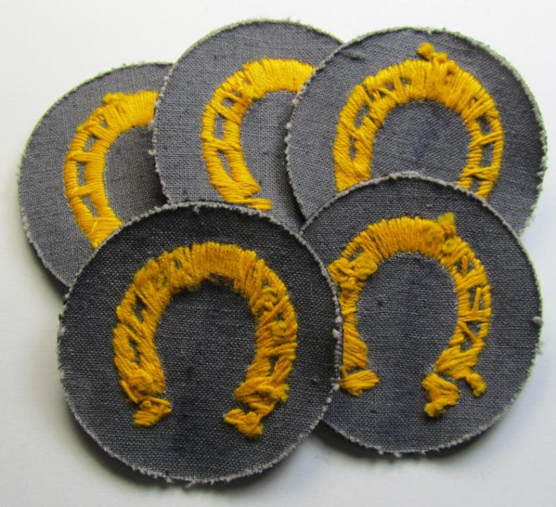 Attractive, WH (Heeres) so-called: trade- and/or special career arm-insignia as was intended for a: 'Hufbeschlagmeister' (or: farrier) being a neatly hand-embroidered 'variant' as executed on darker-green-coloured wool