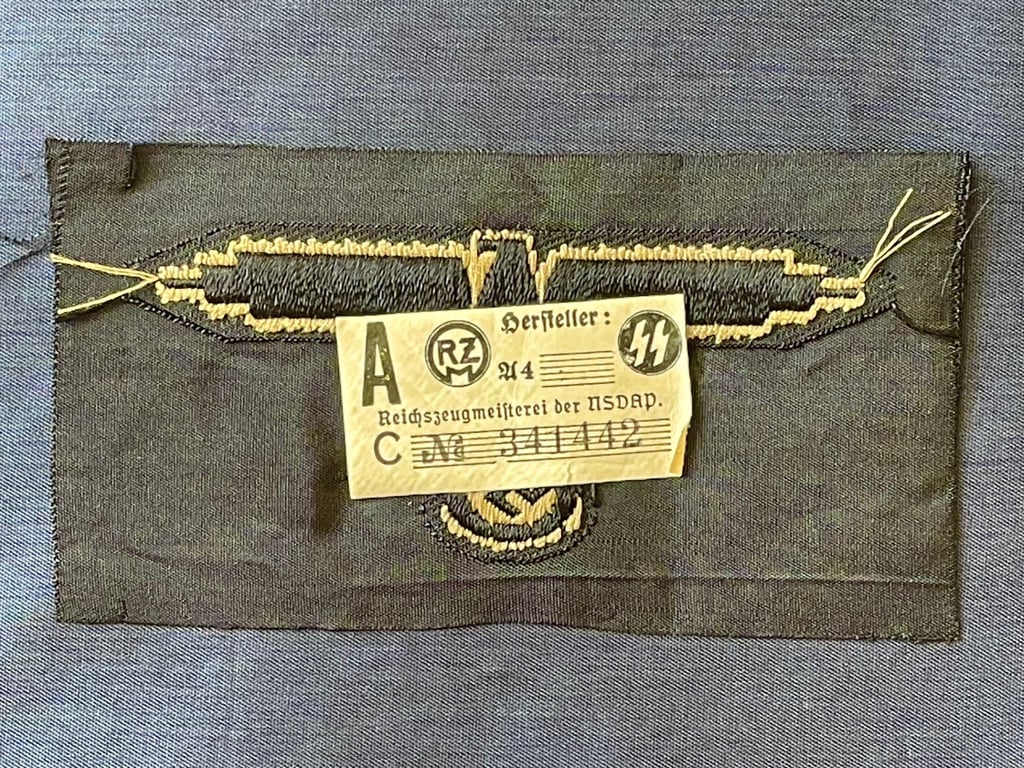WWII GERMAN WAFFEN SS ARM EAGLE WITH SS PAPER ISSUED RZM TAG REMAINING.