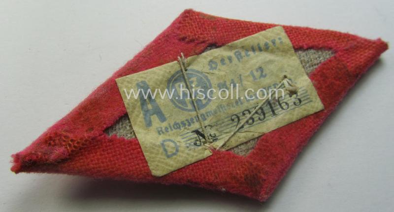 SA- (ie. 'Sturmabteilungen'-) related, aluminium-based cap- (ie. 'Kepi'-) device that came mounted onto its bright-pink-toned, 'Raute'-shaped 'backing' (that still shows its period-attached 'RzM'-etiket)