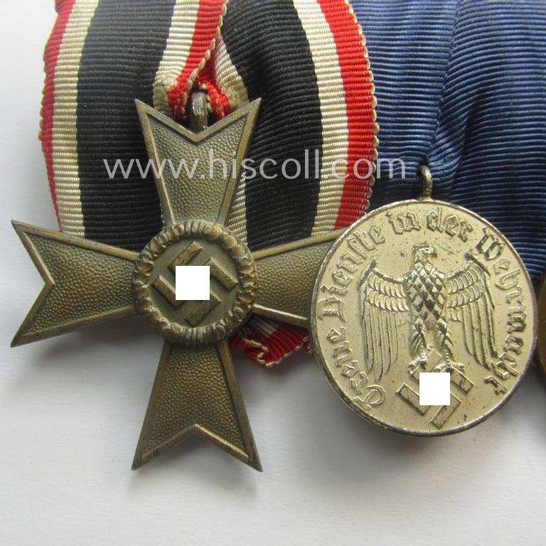 4-pieced, WH (Heeres, LW, etc.) medal-bar (ie. 'Ordenspange') showing a: 'KvK II.Kl. ohne Schw.', a: WH so-called: 'DA für 4 Jahre t. Dienste', a: WH Czech 'Anschluss'-medal: '1. Oktober 1938' and a: 'Westwall'-medal